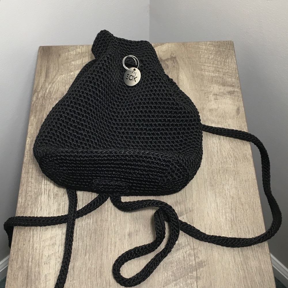 The Sak Black Crochet Drawstring Crossbody or backpack.